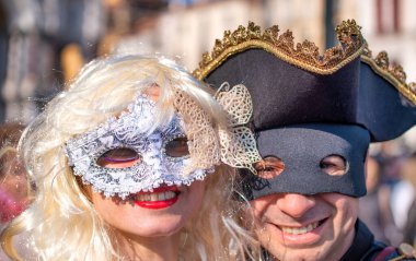 Venice, Italy - February 8th, 2015: People masquerading at the famous Venice Carnival.