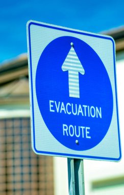 Evacuation route signal, blue on white.