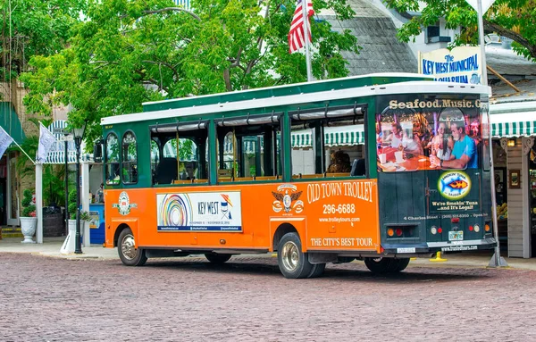 Key West, FL - February 21, 2016: City orange trolley is a famous tourist attraction.