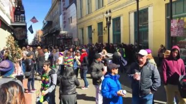 New Orleans, LA - February 9, 2016: Crowd of tourists and locals along the city streets for Mardi Gras event.