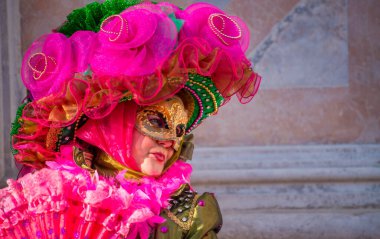 Venice, Italy - February 8th, 2015: People masquerading at the famous Venice Carnival.