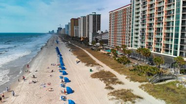 Aerial view of Myrtle Beach, South Carolina. Buildings and beach at sunset.