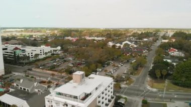 Aerial view of Myrtle Beach, South Carolina. Buildings and beach at sunset.