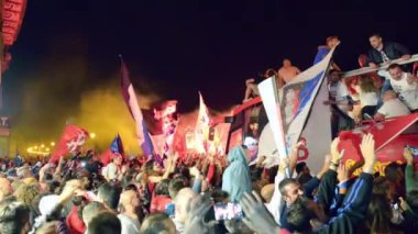 PISA, ITALY - JUNE 15TH, 2016: Celebrations on the night for the soccer teams promotion. People mad with joy in the street.