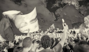 PISA, ITALY - JUNE 15TH, 2016: Local fans celebrate the soccer team's promotion. Celebrations in the night.