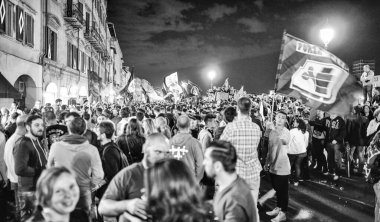 PISA, ITALY - JUNE 15TH, 2016: Local fans celebrate the soccer team's promotion. Celebrations in the night.