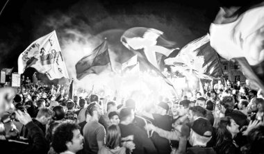 PISA, ITALY - JUNE 15TH, 2016: Celebrations on the night for the soccer team's promotion. People mad with joy in the street.