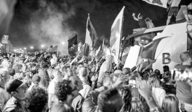 PISA, ITALY - JUNE 15TH, 2016: Celebrations on the night for the soccer team's promotion. People mad with joy in the street.