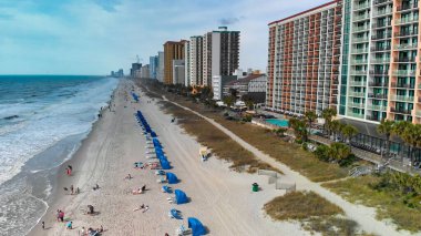 Aerial view of Myrtle Beach, South Carolina. Buildings and beach at sunset.
