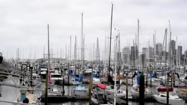 AUCKLAND, NEW ZEALAND - AUGUST 2018: Beautiful view of city port and skyline on a cloudy day.