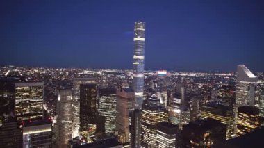 NEW YORK CITY - DECEMBER 7, 2018: Skyscrapers of Midtown Manhattan with night lights, aerial view.