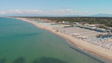 Bathhouse and beach chairs, aerial view on a beautiful sunny day.