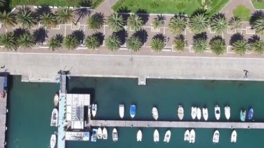 Overhead aerial view of city promenade along the sea.