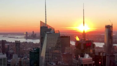 NEW YORK CITY - DECEMBER 2018: Aerial view of Manhattan lights at sunset. The city attracts 50 million visitors every year.
