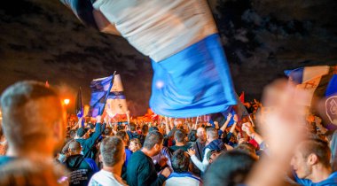 PISA, ITALY - JUNE 15TH, 2016: Celebrations on the night for the soccer team's promotion. People mad with joy in the street.
