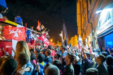 PISA, ITALY - JUNE 15TH, 2016: Celebrations on the night for the soccer team's promotion. People mad with joy in the street.