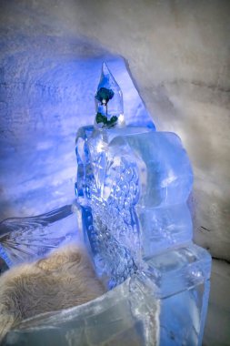 Tunnel made by ice underground with sculptures.