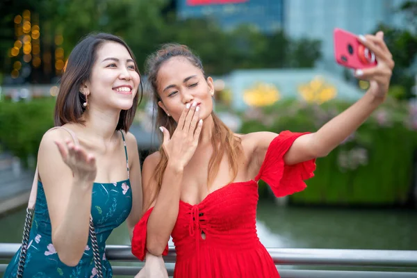 Two Happy Asian Women Taking Selfies Outdoor Smartphone — Fotografia de Stock