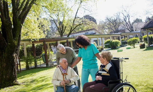 Afroamerican Nurse Joking Elder Disabled People Outdoor — Stock Photo, Image