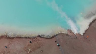 Hot geothermal pool of Hverir Myvatn Lake. Iceland blue water steam, overhead aerial view.