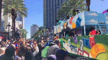 New Orleans, LA - February 9, 2016: Mardi Gras floats parade through the streets of New Orleans.People celebrated crazily. Mardi Gras is the biggest celebration the city of New Orleans hosts every year.