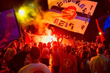 PISA, ITALY - JUNE 15TH, 2016: Local fans celebrate the soccer team's promotion. Celebrations in the night with smoke bombs.