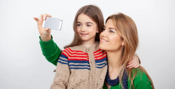 Happy Woman Embracing Her Daughter Home Christmas Taking Selfies — Stock Photo, Image