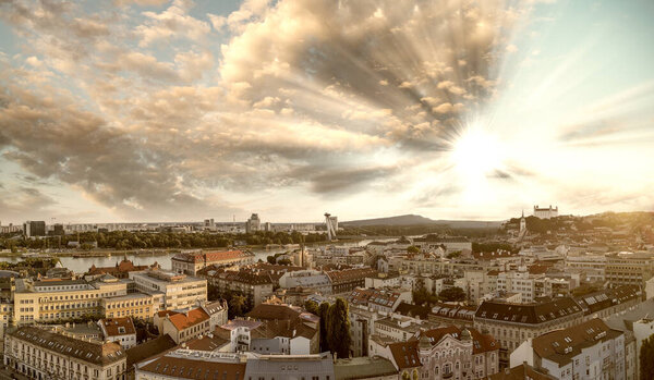 Bratislava, Slovakia. Aerial view of city center at sunset. Panoramic viewpoint from drone.