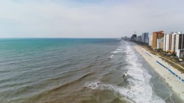 Aerial view of Myrtle Beach, South Carolina. Buildings and beach at sunset.