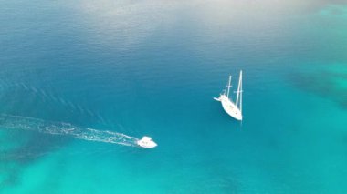 Small boat in Cape Amarandos aerial view in Skopelos, Greece.