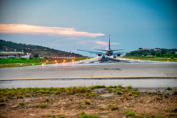 Airplane arriving at Skiathos airport.