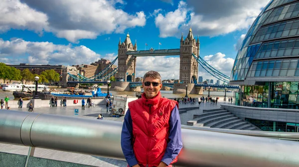 A happy male tourist in London, UK.