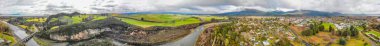 Panoramic aerial view of Turangi and Lake Taupo landscape at sunset, New Zealand.
