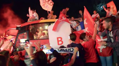 PISA, ITALY - JUNE 15TH, 2016: Celebrations on the night for the soccer team's promotion. People mad with joy in the street.
