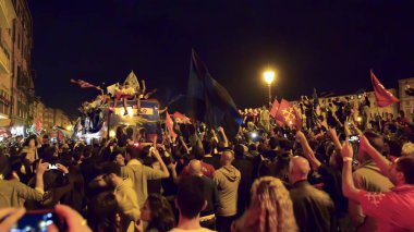 PISA, ITALY - JUNE 15TH, 2016: Celebrations on the night for the soccer team's promotion. People mad with joy in the street.