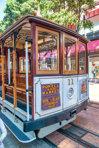 San Francisco, CA - August 6, 2017: City tram and buildings on a sunny day.