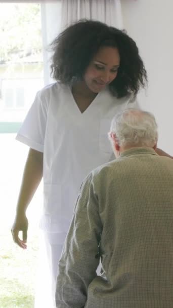 Afroamerican Doctor Helping Elderly People Hospital Vertical Video — Stock Video