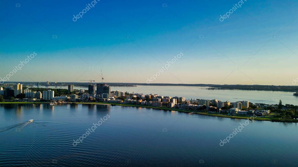 Aerial view of Perth skyline at sunset from Swan River, Western Australia