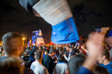 PISA, ITALY - JUNE 15TH, 2016: Celebrations on the night for the soccer team's promotion. People mad with joy in the street.