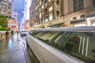 Limousine in Midtown Manhattan at night - New York City. clipart