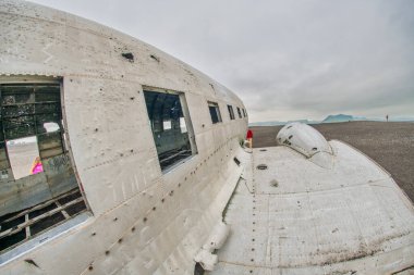 Exterior of airplane, wreckage from an airplane crash in Iceland on Solheimasandur black sand beach.