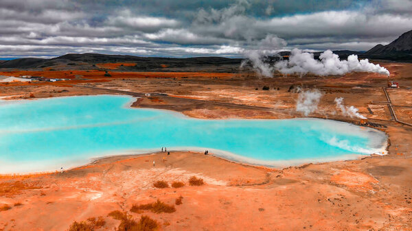 Aerial view of Blue lake made from water coming out of geothermal power plant from above, Iceland.
