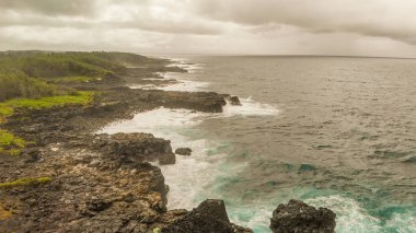 Aerial view of Mauritius Island coastline along Pont Naturel arch formation.