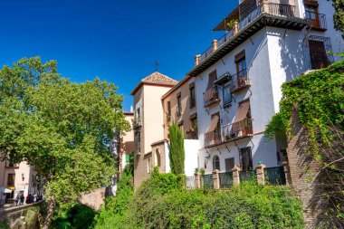 Granada, Spain - April 13, 2023: Tourists along the city streets.