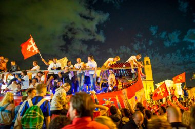 PISA, ITALY - JUNE 15TH, 2016: Local fans celebrate the soccer team's promotion. Celebrations in the night.