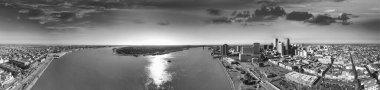 New Orleans, Louisiana - Panoramic aerial view of cityscape and Mississippi River at sunset.
