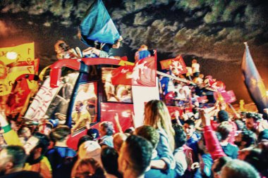 PISA, ITALY - JUNE 15TH, 2016: Celebrations on the night for the soccer team's promotion. People mad with joy in the street.