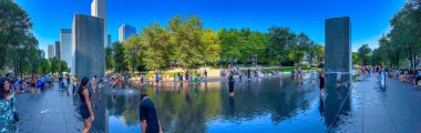 Chicago, IL - July 26, 2024: Tourists and locals relax at Millennium Park on a beautiful summer day. Panoramic view. clipart