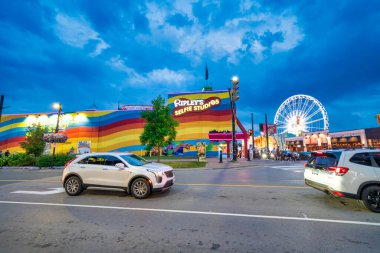 Niagara Falls, Canada - August 5, 2024: Downtown Niagara Falls streets and buildings at night in summer season. clipart