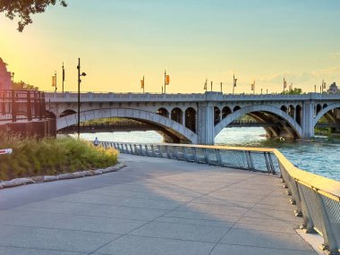 Bridge along Calgary waterfront at sunset. clipart